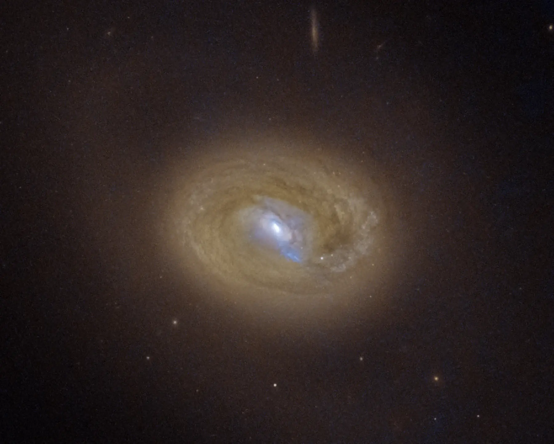 Hubble visible-light image of the dust-rich galaxy MCG-03-34-64, with compact emission in its active nucleus.